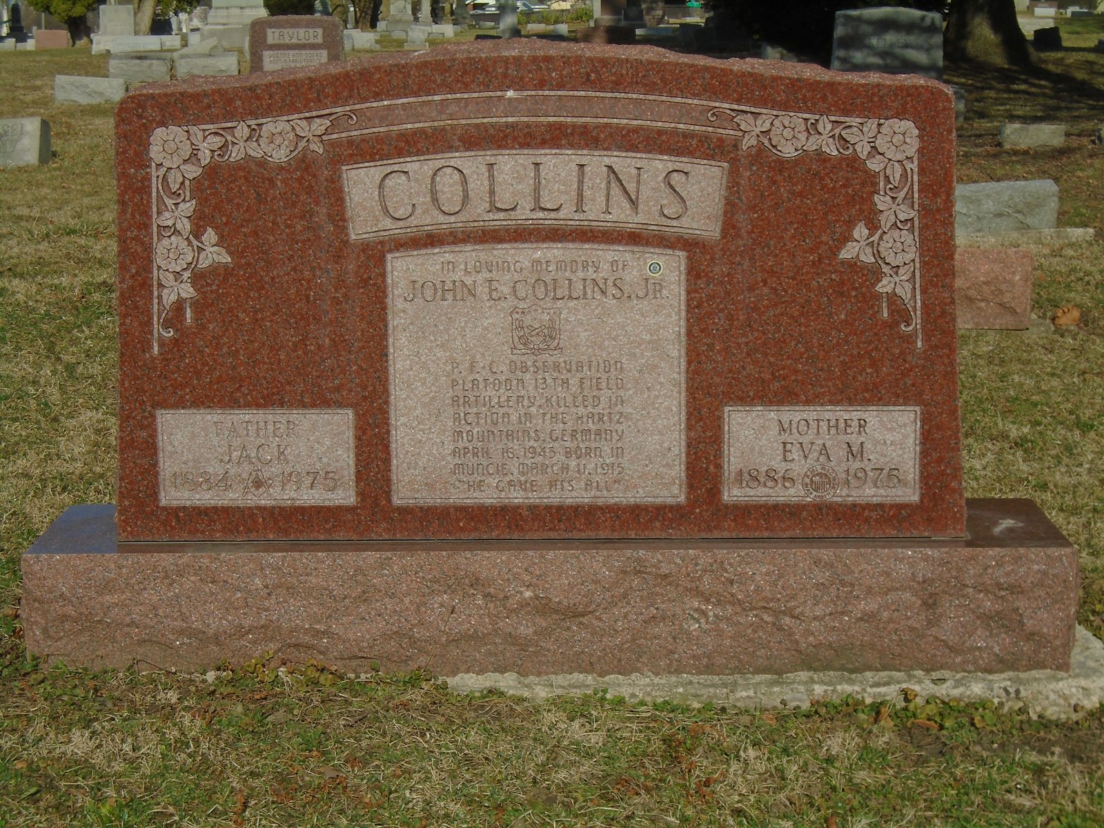 A headstone of a man and a woman in a cemetery.