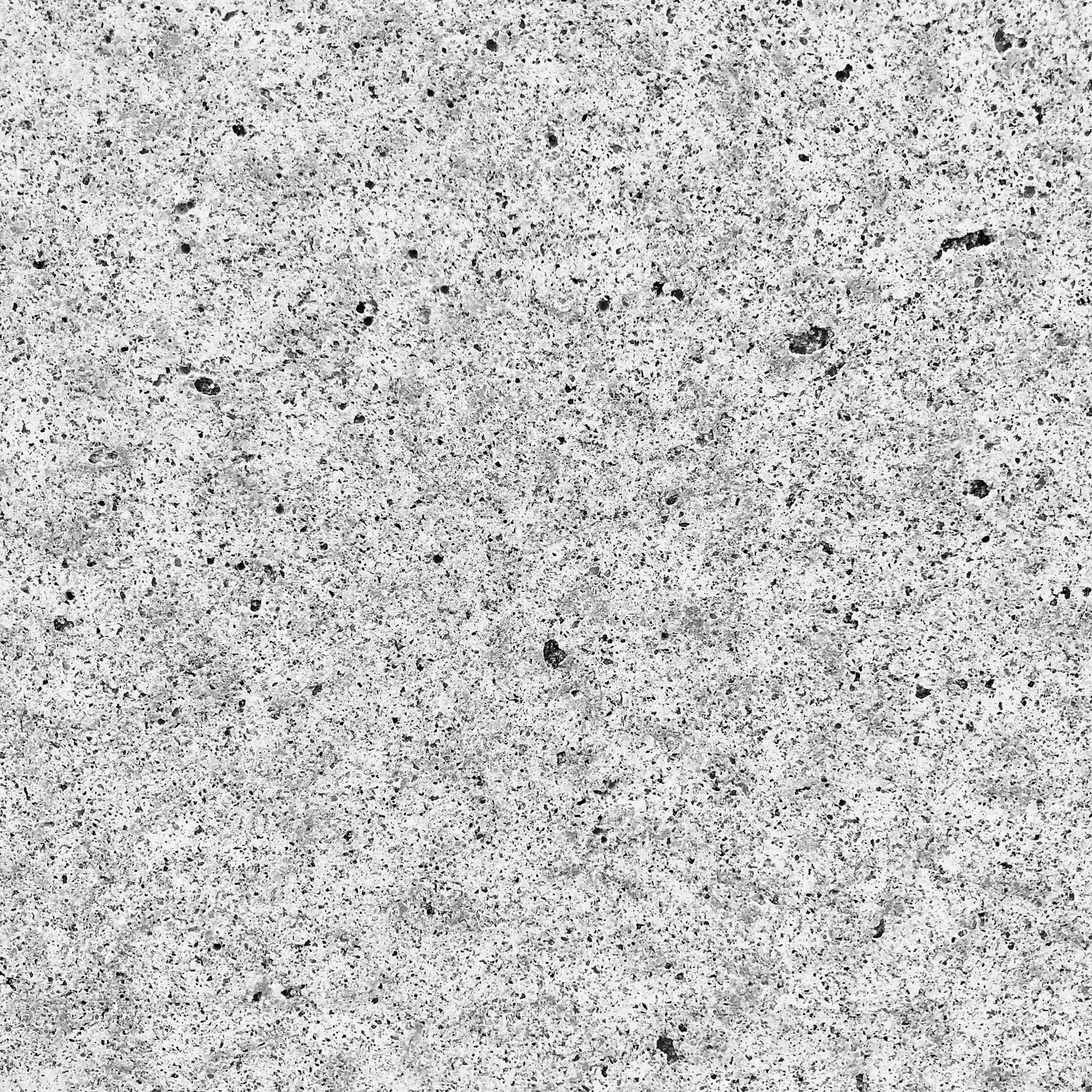 A black and white photo of a concrete surface.