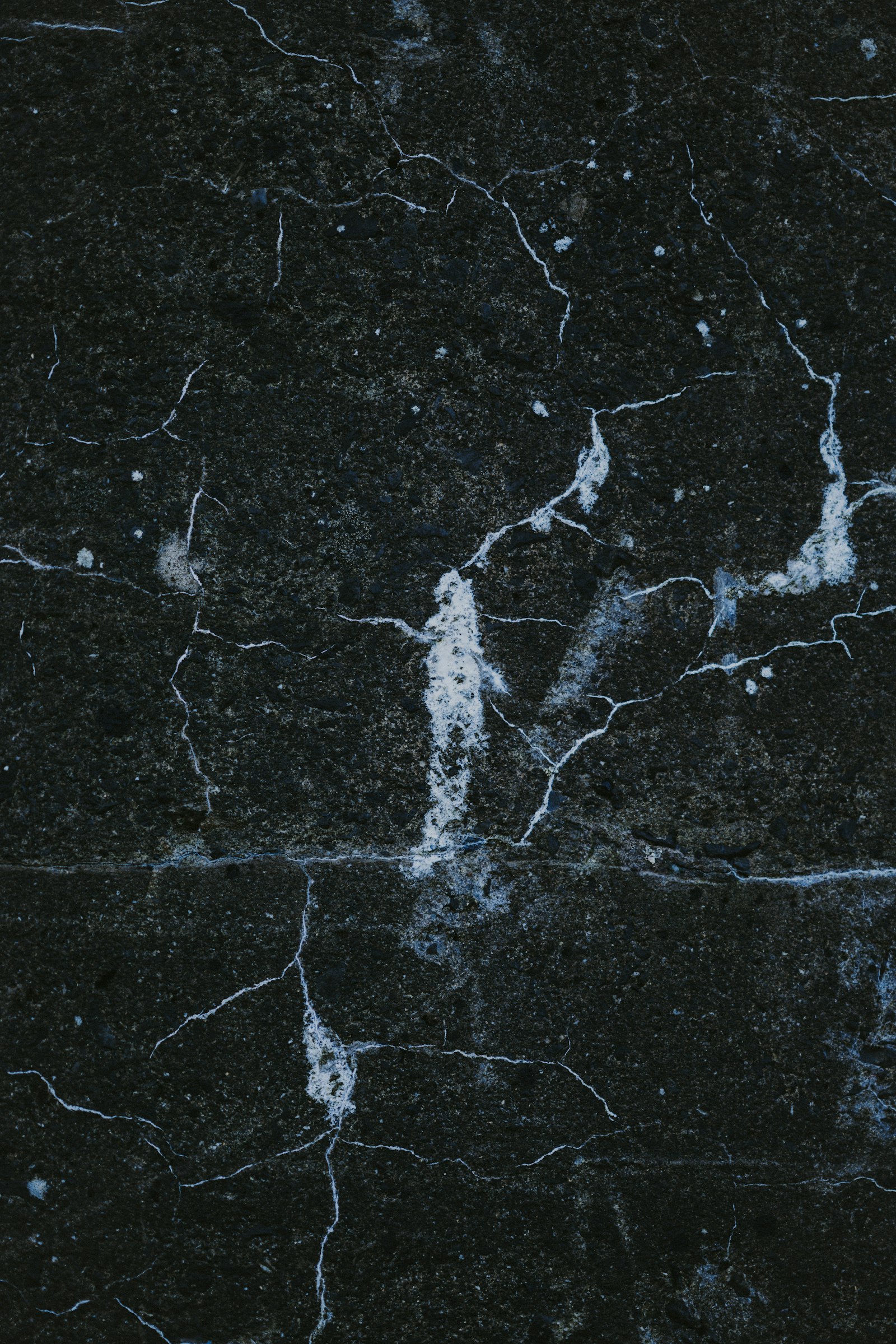 A close up of a black marble surface.